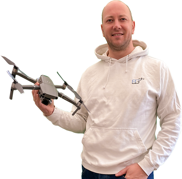 body shot photo of Philippe Francken wearing a Bristol Drones hoody and holding a "DJI" "Mavic 2 Pro" drone