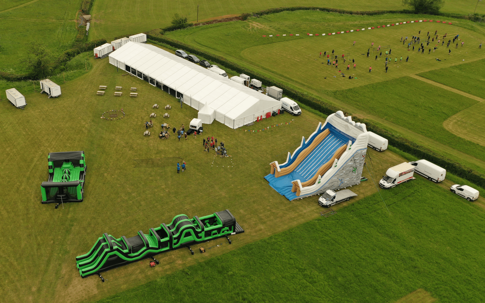 "Mavic 2 Pro" aerial drone photo of inflatable obstacle course in field at "Hydrock" corporate event in almondsbury bristol